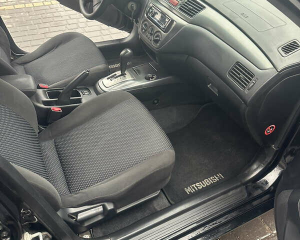 Чорний Міцубісі Lancer, об'ємом двигуна 1.6 л та пробігом 270 тис. км за 4500 $, фото 4 на Automoto.ua