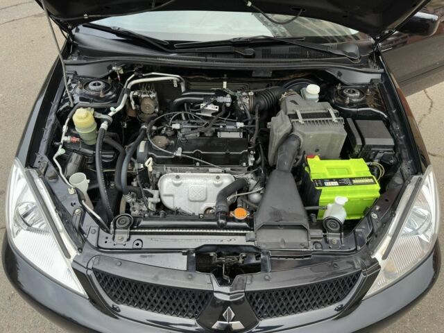 Черный Мицубиси Лансер, объемом двигателя 1.6 л и пробегом 173 тыс. км за 4700 $, фото 18 на Automoto.ua