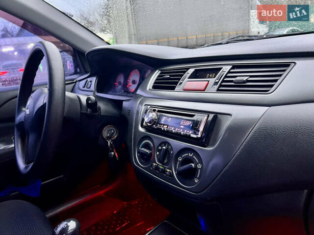 Чорний Міцубісі Lancer, об'ємом двигуна 1.6 л та пробігом 303 тис. км за 4350 $, фото 25 на Automoto.ua