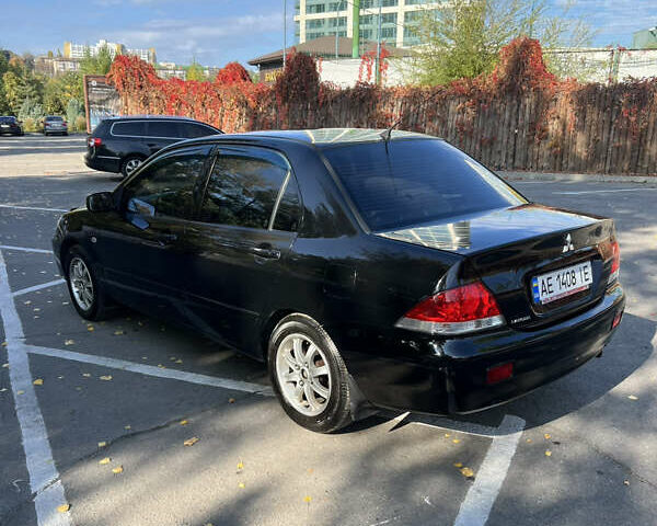 Чорний Міцубісі Lancer, об'ємом двигуна 1.58 л та пробігом 175 тис. км за 5200 $, фото 3 на Automoto.ua