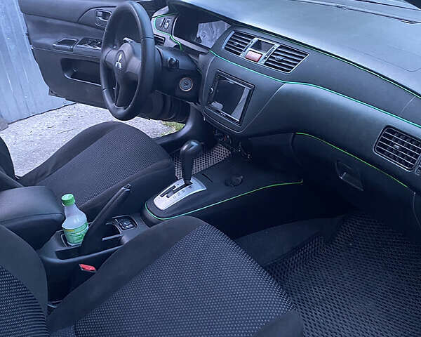 Чорний Міцубісі Lancer, об'ємом двигуна 1.6 л та пробігом 195 тис. км за 5200 $, фото 25 на Automoto.ua