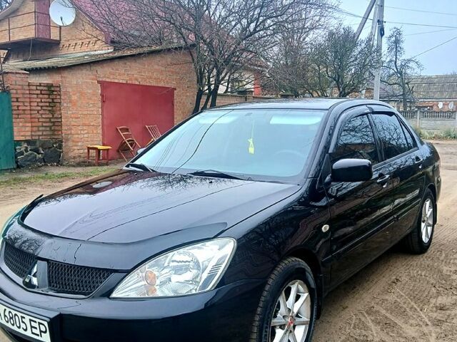 Чорний Міцубісі Lancer, об'ємом двигуна 1.6 л та пробігом 240 тис. км за 4700 $, фото 11 на Automoto.ua