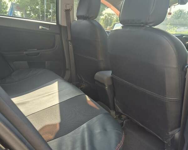 Чорний Міцубісі Lancer, об'ємом двигуна 2 л та пробігом 243 тис. км за 6600 $, фото 25 на Automoto.ua