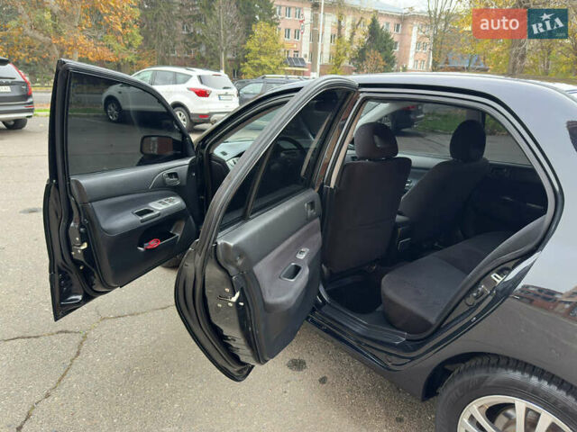 Чорний Міцубісі Lancer, об'ємом двигуна 1.58 л та пробігом 173 тис. км за 4700 $, фото 10 на Automoto.ua