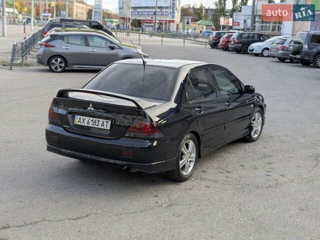 Чорний Міцубісі Lancer, об'ємом двигуна 2 л та пробігом 152 тис. км за 5500 $, фото 5 на Automoto.ua