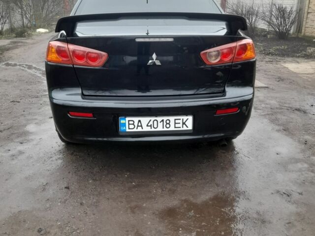 Черный Мицубиси Лансер, объемом двигателя 2 л и пробегом 215 тыс. км за 5700 $, фото 2 на Automoto.ua