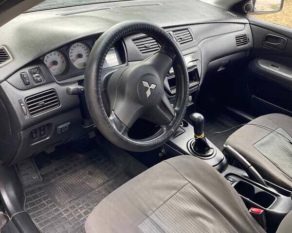 Чорний Міцубісі Lancer, об'ємом двигуна 1.58 л та пробігом 231 тис. км за 4300 $, фото 4 на Automoto.ua