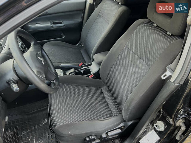 Чорний Міцубісі Lancer, об'ємом двигуна 1.58 л та пробігом 185 тис. км за 3750 $, фото 10 на Automoto.ua