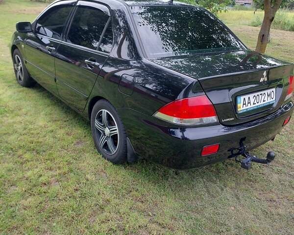 Черный Мицубиси Лансер, объемом двигателя 1.6 л и пробегом 210 тыс. км за 5500 $, фото 7 на Automoto.ua