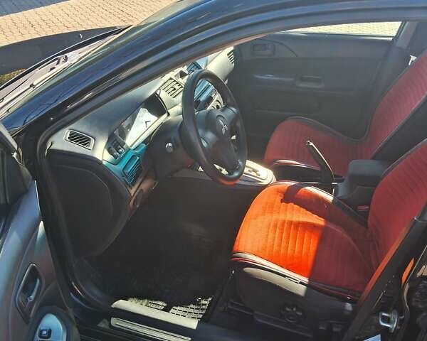 Міцубісі Lancer 2007 у Чернівцях на Automoto.ua Чорний Міцубісі Lancer, об'ємом двигуна 1.58 л та пробігом 247 тис. км за 4300 $, фото 6 на Automoto.ua