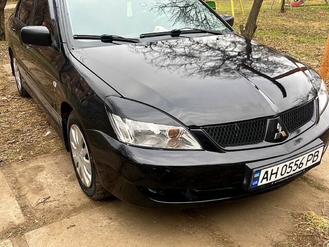 Чорний Міцубісі Lancer, об'ємом двигуна 1.6 л та пробігом 222 тис. км за 4000 $, фото 1 на Automoto.ua
