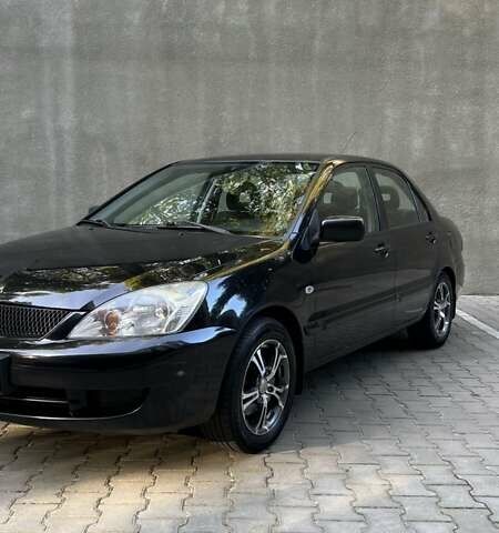 Чорний Міцубісі Lancer, об'ємом двигуна 1.58 л та пробігом 135 тис. км за 4100 $, фото 10 на Automoto.ua