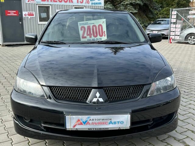 Мицубиси Лансер 2007 в Кривом Роге на Automoto.ua Черный Мицубиси Лансер, объемом двигателя 2 л и пробегом 143 тыс. км за 5400 $, фото 1 на Automoto.ua