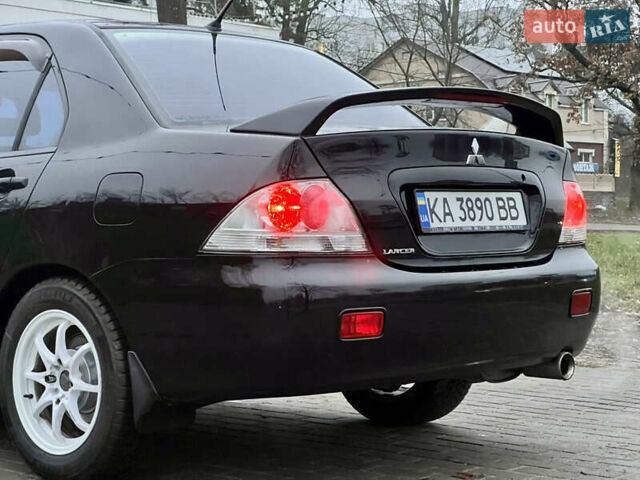 Чорний Міцубісі Lancer, об'ємом двигуна 1.6 л та пробігом 303 тис. км за 4350 $, фото 17 на Automoto.ua