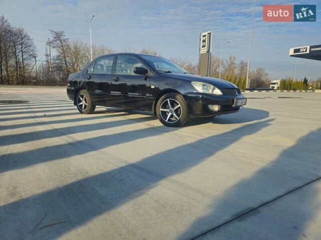 Чорний Міцубісі Lancer, об'ємом двигуна 1.59 л та пробігом 180 тис. км за 4999 $, фото 1 на Automoto.ua