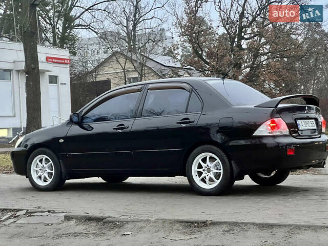 Чорний Міцубісі Lancer, об'ємом двигуна 1.6 л та пробігом 303 тис. км за 4350 $, фото 9 на Automoto.ua