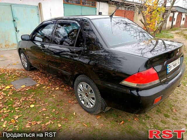 Чорний Міцубісі Lancer, об'ємом двигуна 1.6 л та пробігом 227 тис. км за 4100 $, фото 6 на Automoto.ua