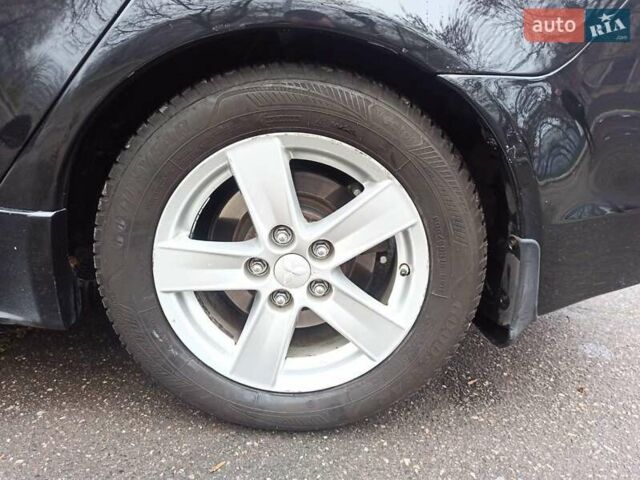 Черный Мицубиси Лансер, объемом двигателя 2 л и пробегом 195 тыс. км за 7899 $, фото 34 на Automoto.ua