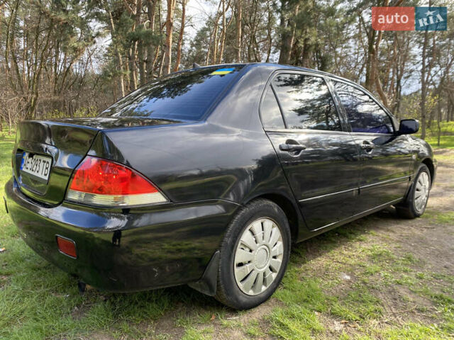 Чорний Міцубісі Lancer, об'ємом двигуна 1.6 л та пробігом 224 тис. км за 4950 $, фото 6 на Automoto.ua