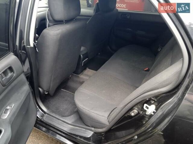 Черный Мицубиси Лансер, объемом двигателя 1.58 л и пробегом 180 тыс. км за 4500 $, фото 1 на Automoto.ua