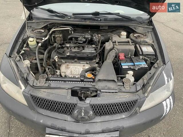 Черный Мицубиси Лансер, объемом двигателя 1.58 л и пробегом 263 тыс. км за 4000 $, фото 21 на Automoto.ua