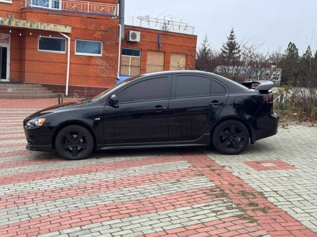 Черный Мицубиси Лансер, объемом двигателя 2 л и пробегом 217 тыс. км за 5500 $, фото 3 на Automoto.ua