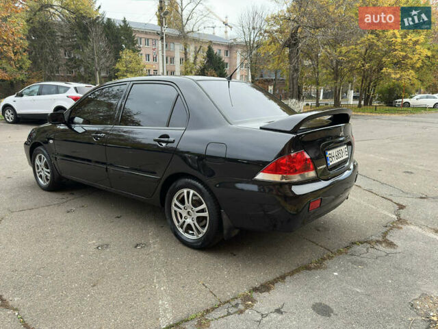 Чорний Міцубісі Lancer, об'ємом двигуна 1.58 л та пробігом 173 тис. км за 4700 $, фото 2 на Automoto.ua