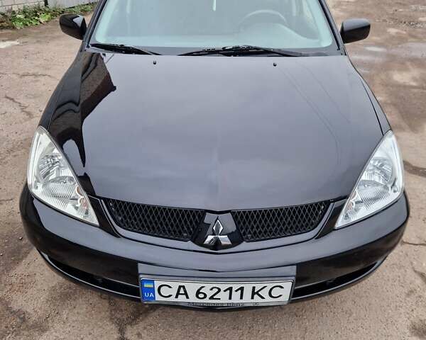 Чорний Міцубісі Lancer, об'ємом двигуна 1.6 л та пробігом 273 тис. км за 3999 $, фото 1 на Automoto.ua