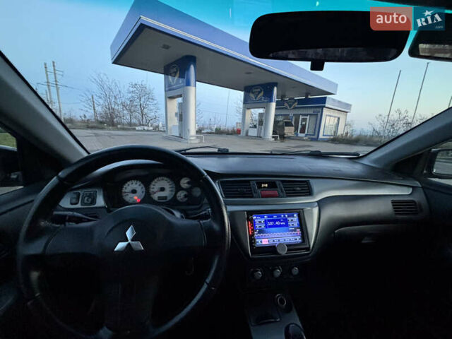 Черный Мицубиси Лансер, объемом двигателя 1.6 л и пробегом 315 тыс. км за 4000 $, фото 6 на Automoto.ua