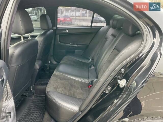 Черный Мицубиси Лансер, объемом двигателя 2 л и пробегом 246 тыс. км за 7500 $, фото 17 на Automoto.ua