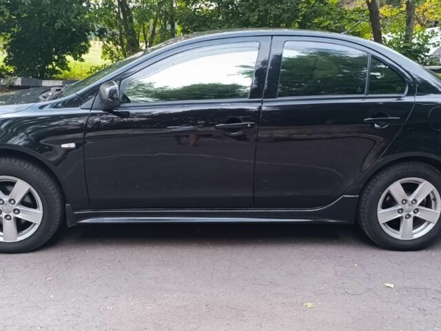 Черный Мицубиси Лансер, объемом двигателя 2 л и пробегом 210 тыс. км за 6000 $, фото 7 на Automoto.ua