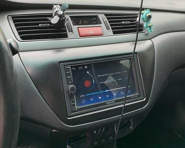 Черный Мицубиси Лансер, объемом двигателя 1.6 л и пробегом 164 тыс. км за 5200 $, фото 11 на Automoto.ua