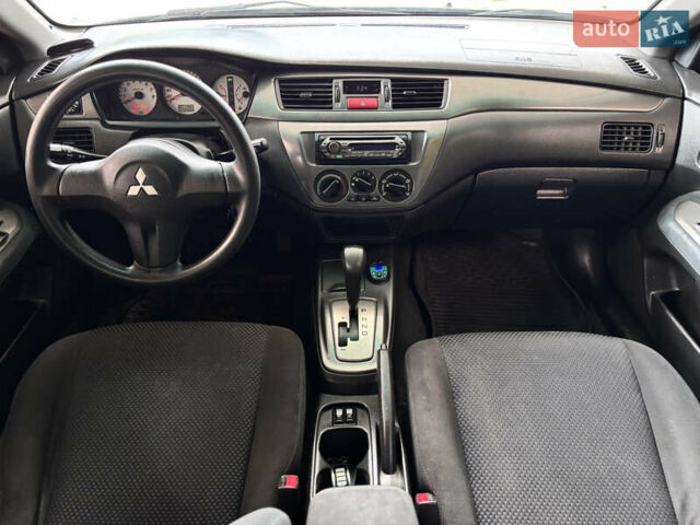 Чорний Міцубісі Lancer, об'ємом двигуна 1.6 л та пробігом 173 тис. км за 3700 $, фото 14 на Automoto.ua