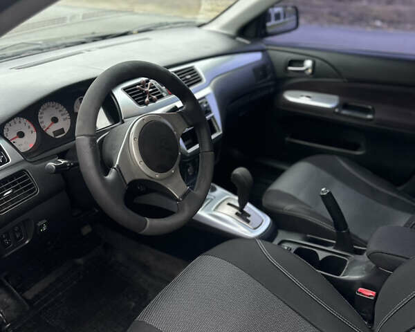 Черный Мицубиси Лансер, объемом двигателя 2 л и пробегом 260 тыс. км за 5300 $, фото 8 на Automoto.ua