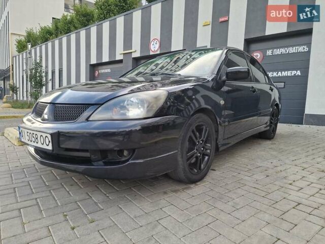 Чорний Міцубісі Lancer, об'ємом двигуна 2 л та пробігом 272 тис. км за 4750 $, фото 2 на Automoto.ua
