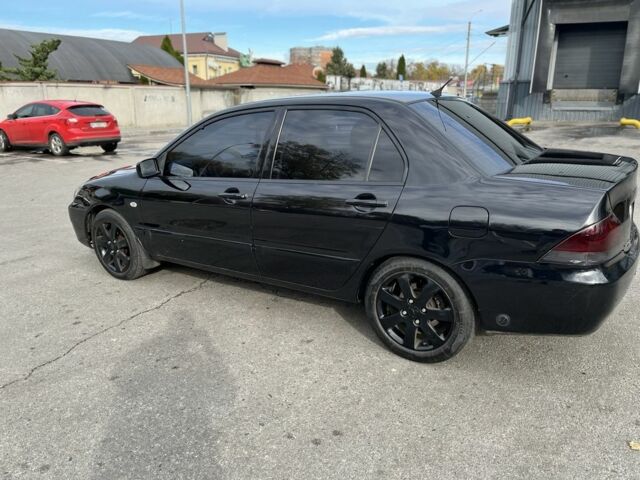 Чорний Міцубісі Lancer, об'ємом двигуна 1.6 л та пробігом 250 тис. км за 4800 $, фото 1 на Automoto.ua