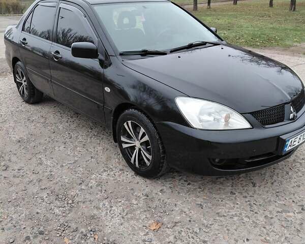 Чорний Міцубісі Lancer, об'ємом двигуна 1.58 л та пробігом 201 тис. км за 4500 $, фото 1 на Automoto.ua