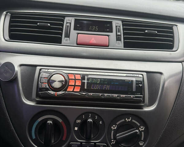 Чорний Міцубісі Lancer, об'ємом двигуна 1.58 л та пробігом 256 тис. км за 3700 $, фото 25 на Automoto.ua