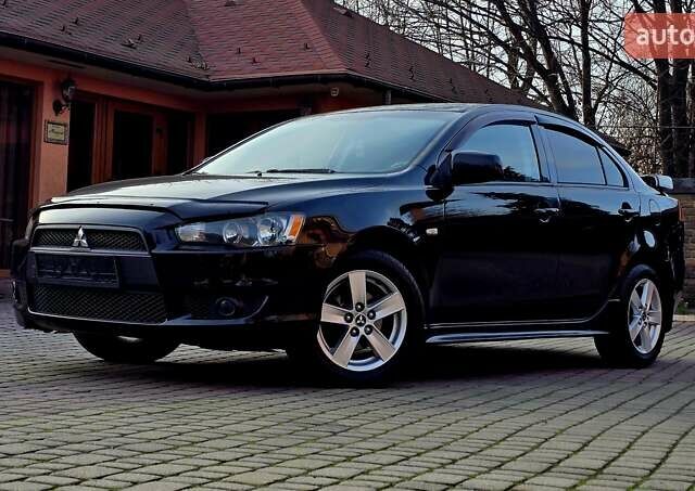 Чорний Міцубісі Lancer, об'ємом двигуна 2 л та пробігом 260 тис. км за 6555 $, фото 1 на Automoto.ua