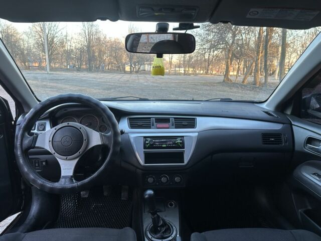 Черный Мицубиси Лансер, объемом двигателя 2 л и пробегом 300 тыс. км за 3999 $, фото 8 на Automoto.ua