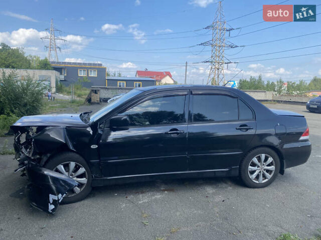 Чорний Міцубісі Lancer, об'ємом двигуна 1.6 л та пробігом 397 тис. км за 1500 $, фото 1 на Automoto.ua