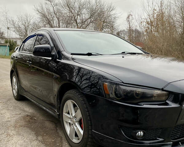 Черный Мицубиси Лансер, объемом двигателя 2 л и пробегом 164 тыс. км за 8300 $, фото 7 на Automoto.ua