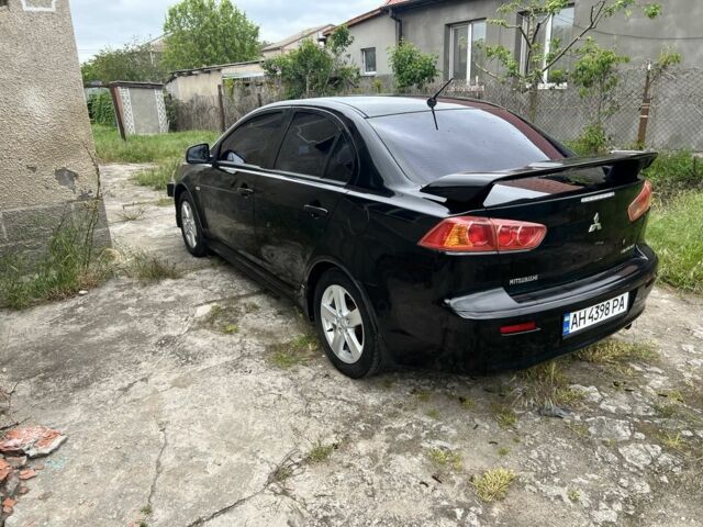 Черный Мицубиси Лансер, объемом двигателя 2 л и пробегом 200 тыс. км за 6900 $, фото 2 на Automoto.ua