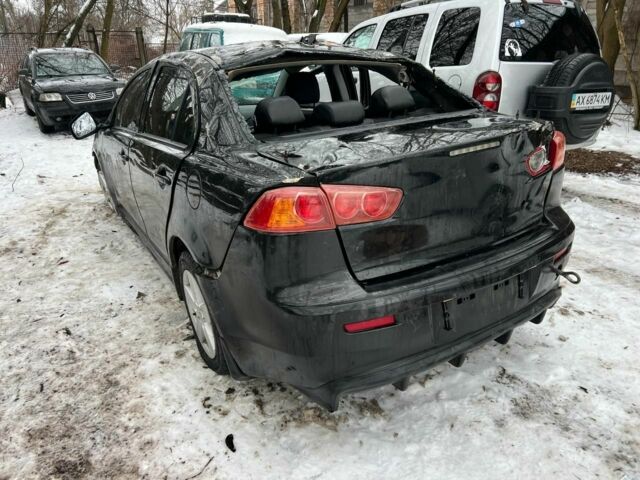 Черный Мицубиси Лансер, объемом двигателя 2 л и пробегом 197 тыс. км за 2500 $, фото 1 на Automoto.ua