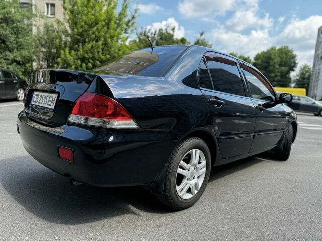 Черный Мицубиси Лансер, объемом двигателя 1.6 л и пробегом 177 тыс. км за 4500 $, фото 2 на Automoto.ua