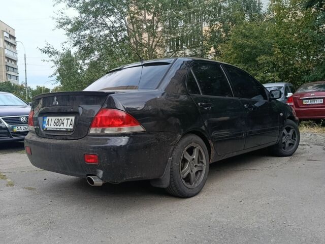 Чорний Міцубісі Lancer, об'ємом двигуна 1.6 л та пробігом 420 тис. км за 3650 $, фото 2 на Automoto.ua