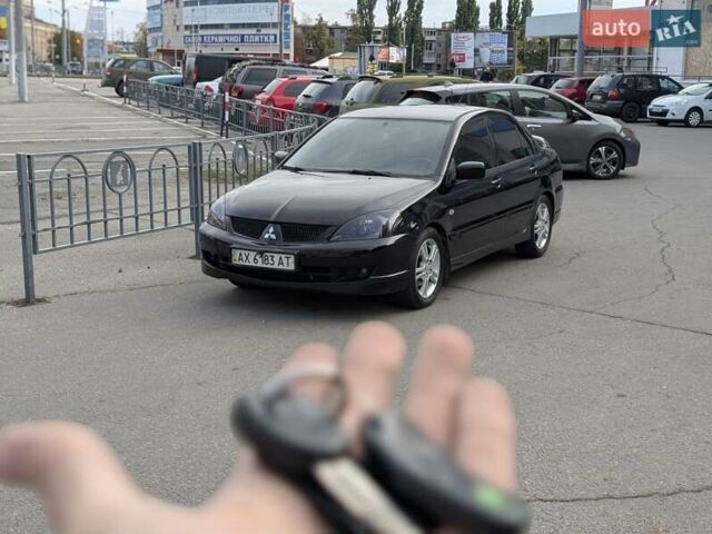 Чорний Міцубісі Lancer, об'ємом двигуна 2 л та пробігом 152 тис. км за 5500 $, фото 32 на Automoto.ua