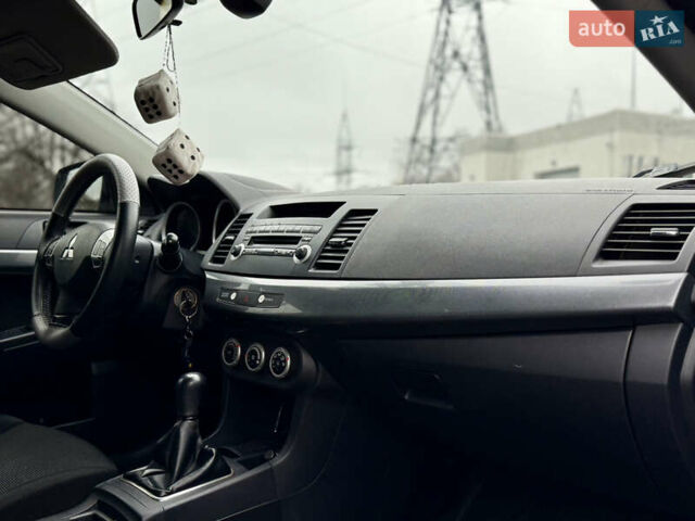 Черный Мицубиси Лансер, объемом двигателя 2 л и пробегом 215 тыс. км за 5500 $, фото 14 на Automoto.ua