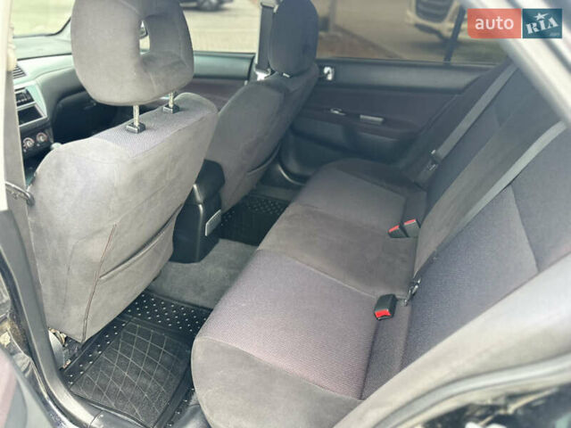 Чорний Міцубісі Lancer, об'ємом двигуна 2 л та пробігом 275 тис. км за 5300 $, фото 39 на Automoto.ua