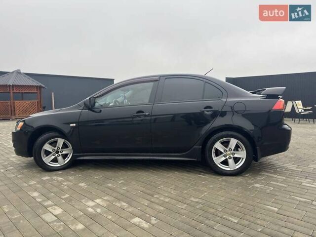 Черный Мицубиси Лансер, объемом двигателя 2 л и пробегом 259 тыс. км за 6500 $, фото 2 на Automoto.ua